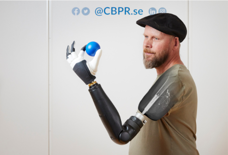 A black-and-white header photo of me wearing a suit. To the left are the logos of the Shirley Ryan AbilityLab, Northwestern University, and Center for Bionics and Pain Research.