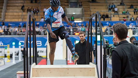 A man with a prosthetic leg competes in a competition to climb stairs